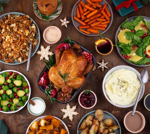 Christmas festive dinner with baked chicken and traditional dishes